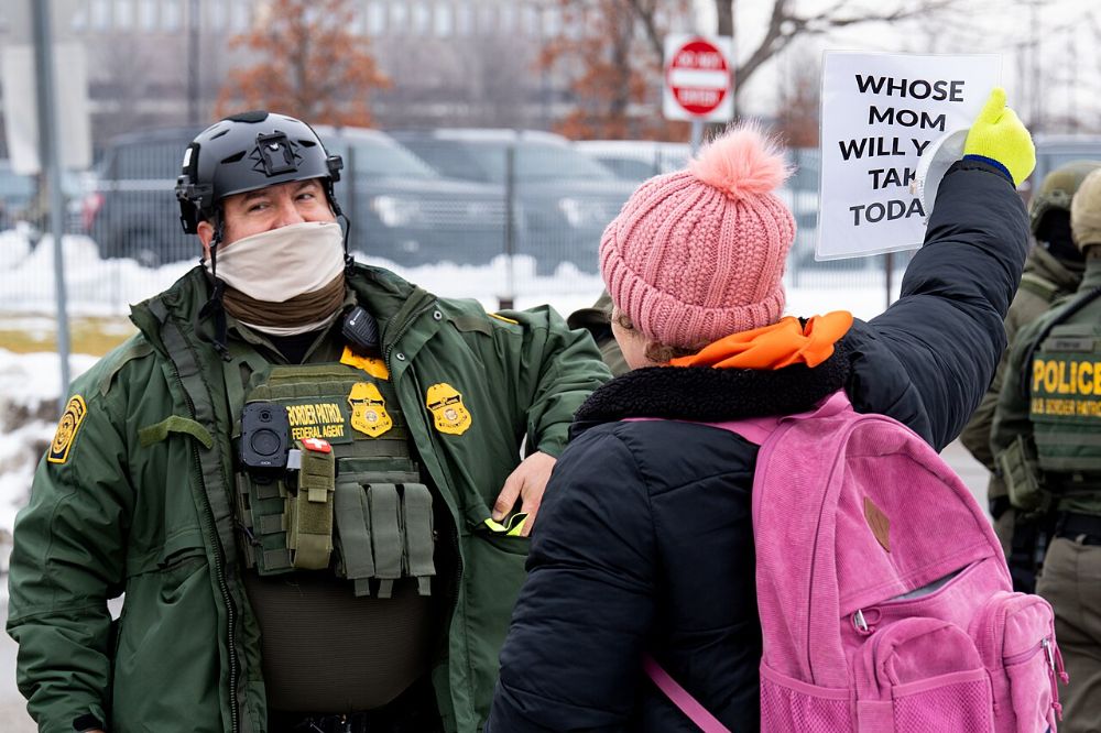 A protester and a Border Patrol agent, Minneapolis