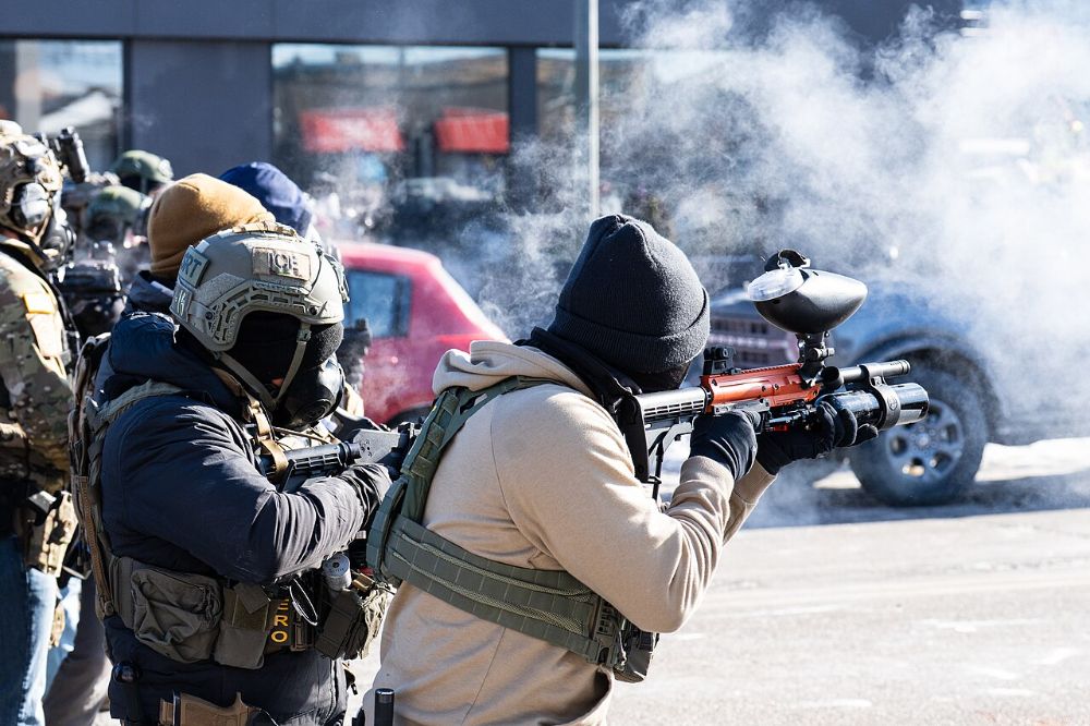 Federal agents fire less-lethal munitions on Nicollet Avenue, Minneapolis, January 24, 2026